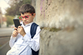 Child using a smartphone - PhotoDune Item for Sale