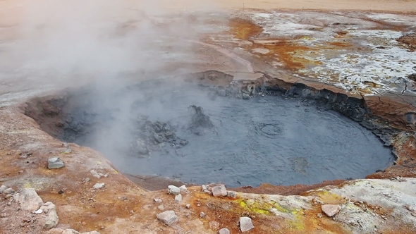 Eruption of Geyser in Iceland. Red Soil, Like the Surface of the Planet Mars