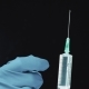 A Doctor or Nurse Keeps a Syringe with an Injection - VideoHive Item for Sale