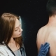 A Dermatologist Examines a Patient. A Woman Doctor Touches Her Birthmarks - VideoHive Item for Sale