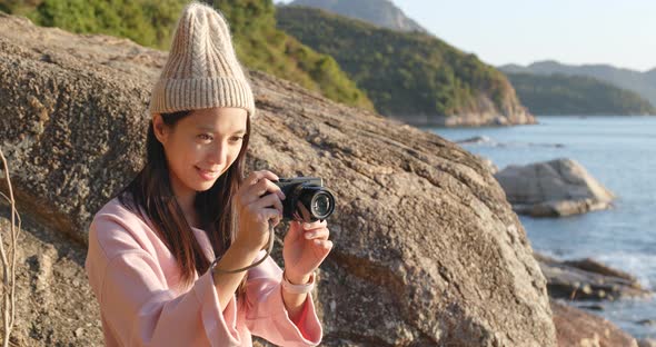 Woman Taking Photo by Camera in The Countryside