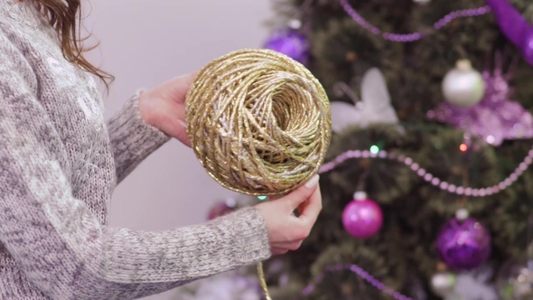 Girl Reel a Ball of Golden Thread