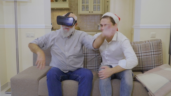 Grandfather with Grandson Uses Virtual Reality Glasses