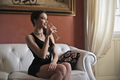 Girl sitting on a sofa - PhotoDune Item for Sale