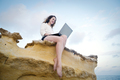 Girl on the rocks with a laptop - PhotoDune Item for Sale