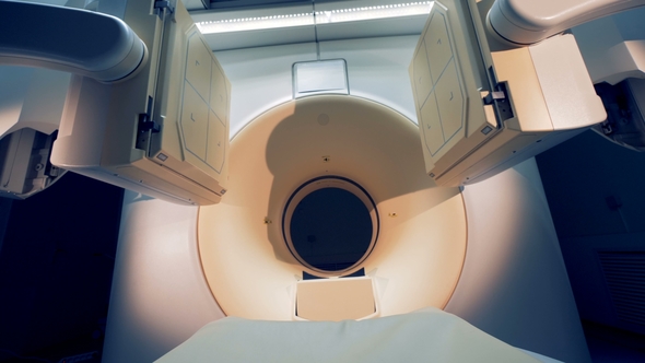 Two Tomographic Scanning Screens Are Moving Closer and Getting Lowered. CT Scanner in Hospital with