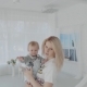 Mother Swinging Her Beautiful Daughter in the Room - VideoHive Item for Sale