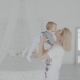 Mother Swinging Her Beautiful Daughter in the Room. Happy Family. - VideoHive Item for Sale