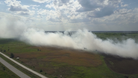 Burning Garbage Dump Pollutes the Environment