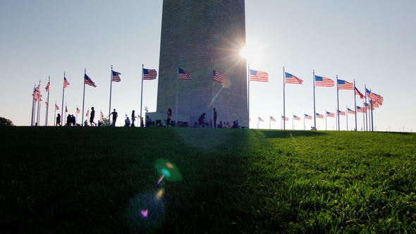 People Are Resting Near the Washington Monument in the Very Center of the American Capital. The Sun