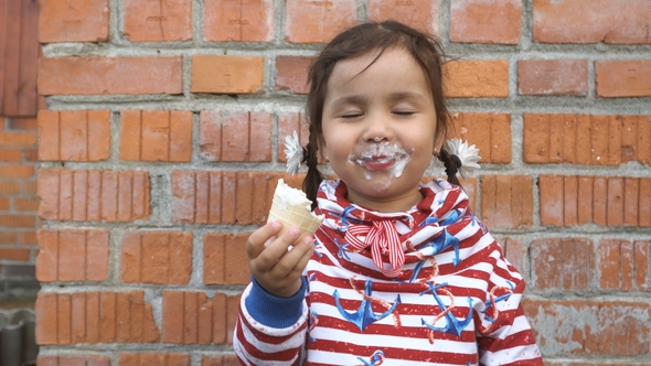 Little Girl Is Eating Ice Cream