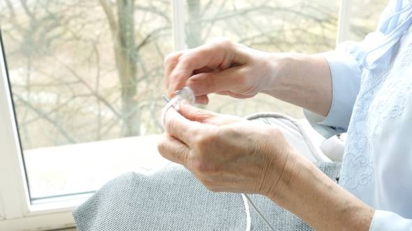 Hands of Elderly Woman Knitting