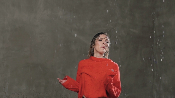 Modern Dance. Wet Girl Dancer Makes Rotation Around Herself in the Studio Under the Rain Water