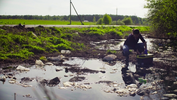 Ecologist Taking Samples of the Water