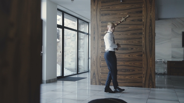 Glamorous Young Man in Stylish Suit Dancing in the Room