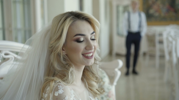 Happy Groom Comes To Smart Bride and Kisses Her in Room