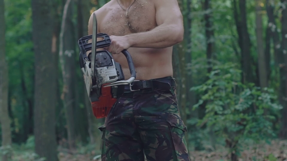 Strong Woodcuter with Chainsaw