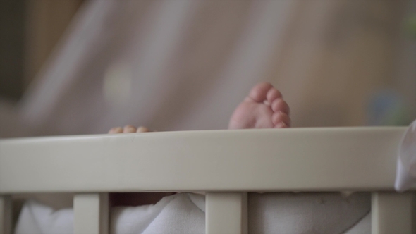 Baby Feet Outside the Crib