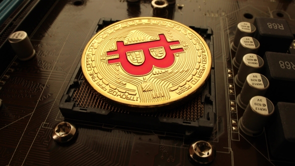 Gold Bit Coin BTC Coins on the Motherboard