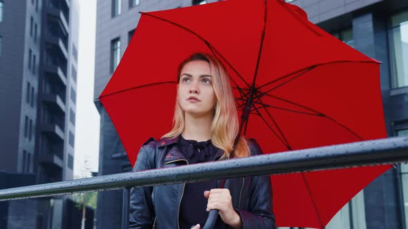 A Portrait of a Woman with Red Umbrella