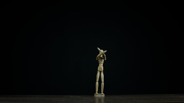 Wooden Figure Dummy in Studio on Black Background Showing Sign No, Screaming
