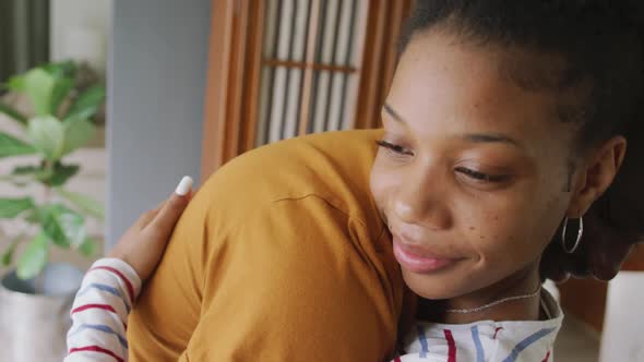 Video of happy african american couple embracing at home