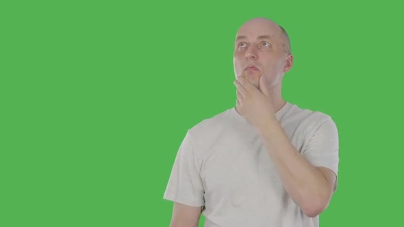 Thoughtful Man Guess. Mature Man Pointing Up and Having Idea. Alpha Channel, Keyed Green Screen