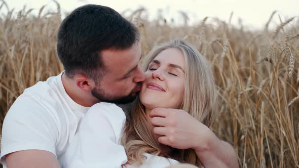 Young Beautiful Couple in a Wheat Field