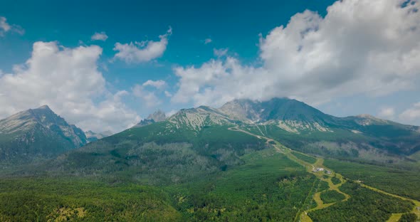 Aerial Hyperlapse of the Mountain Lomnitsky Shield Over Which Clouds Float