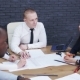 Team of Business People Discussing a Project in a Modern Office - VideoHive Item for Sale