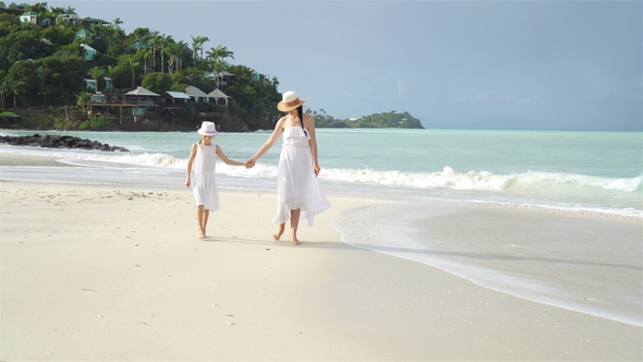 Family Fun on White Sandy Beach. Mother and Little Kid Enjoy Summer Vacation
