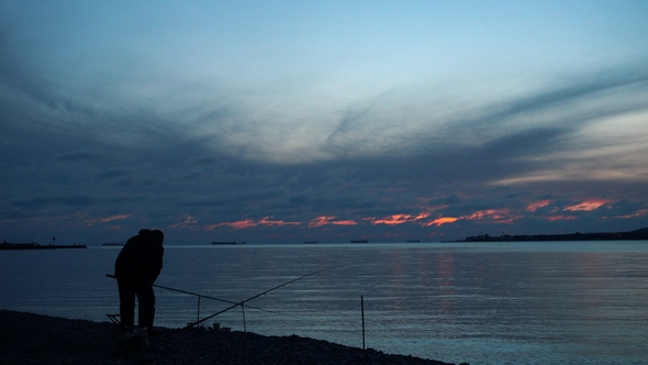 . Fisherman Prepare Fishing Tackle and Catch a Fish.