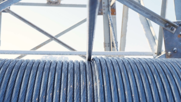 Cable Uncoils From Bobbin at Electrical Station