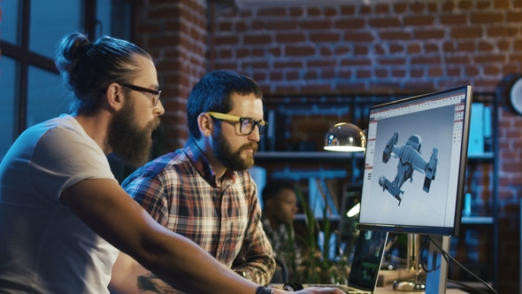 Men Coworking on Graphics of Video Game