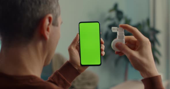 Man Having Video Call with Doctor on Green Screen Mobile