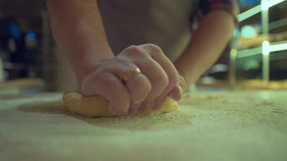 Hands of Male Baker with Flour Dough Is Preparing Food on Wooden Table. Cooking Process, Culinary