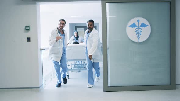 Doctors running with patient in hospital bed in emergency 4k