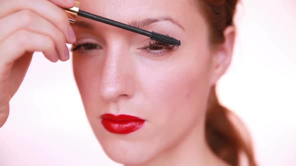 Woman with Red Lips Applying Make Up