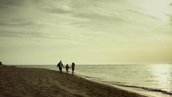 Family Walking Morning Beach