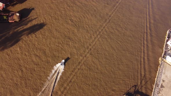 Motorboat leaves water wake on brown waters of Parana river in Buenos Aires province, Argentina. Aer