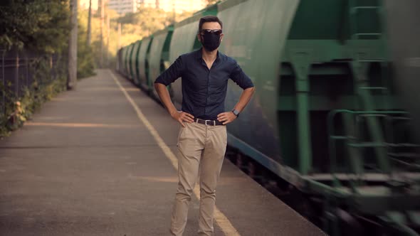 Man Waiting Train In Protective Mask Sars COVID19 Virus. Pandemic Coronavirus Protection Outdoor.