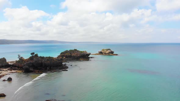 Aerial shot of islands at walkerville Victoria and beautiful vivid blue ocean waters.