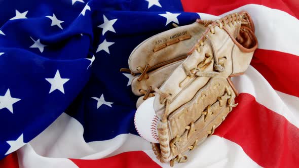 Baseball and gloves on an American flag