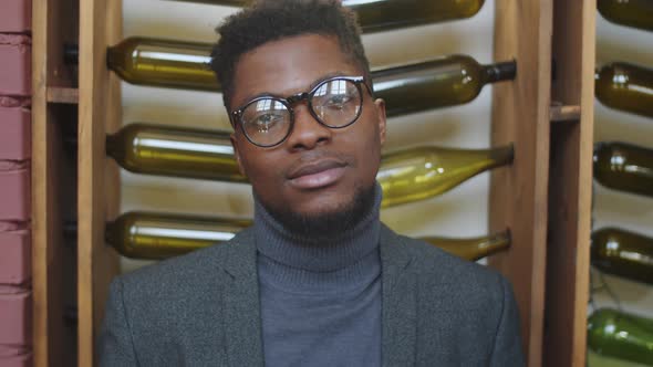 Portrait of Handsome Black Businessman in Restaurant