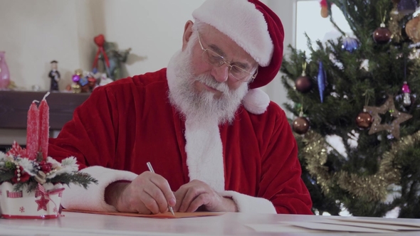 Santa Writes Letter and Put It in Envelope