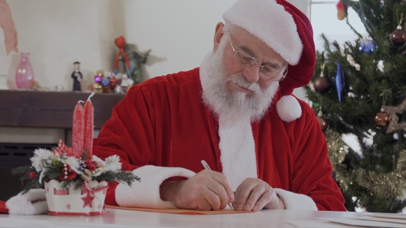 Santa Write Letter Sitting at the Table