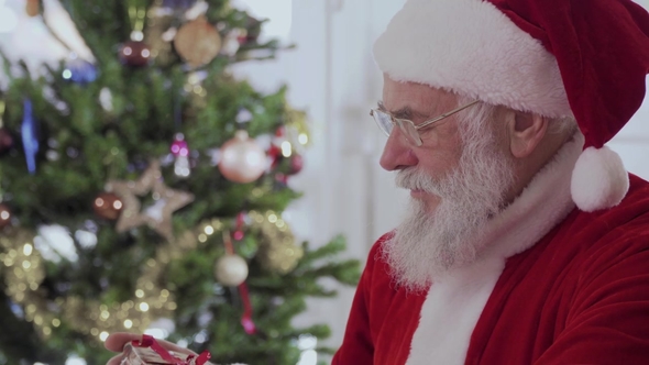 Santa Claus Give the Present on Camera
