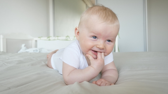 Cute Boy on Bed