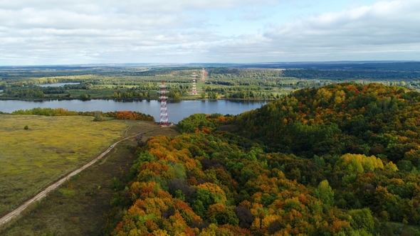 High Voltage Line Transmits Electrical Energy Against Landscape