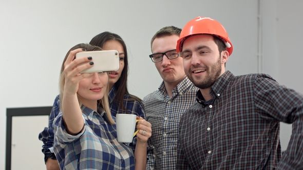 Happy Young Architects Taking Funny Selfies in Office